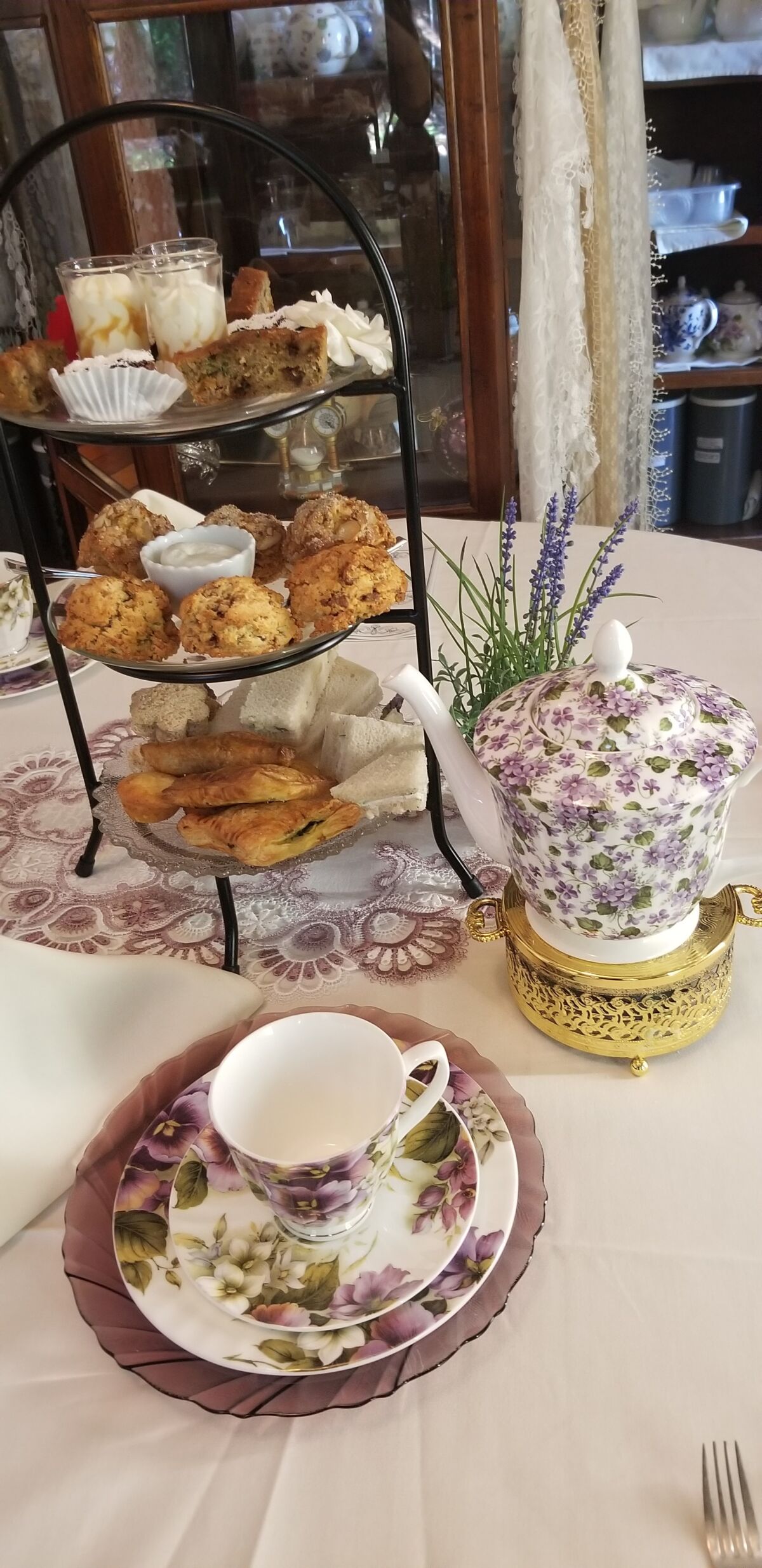 An elegant arrangement of scones, pastries and tea at Coral Tree Tea House