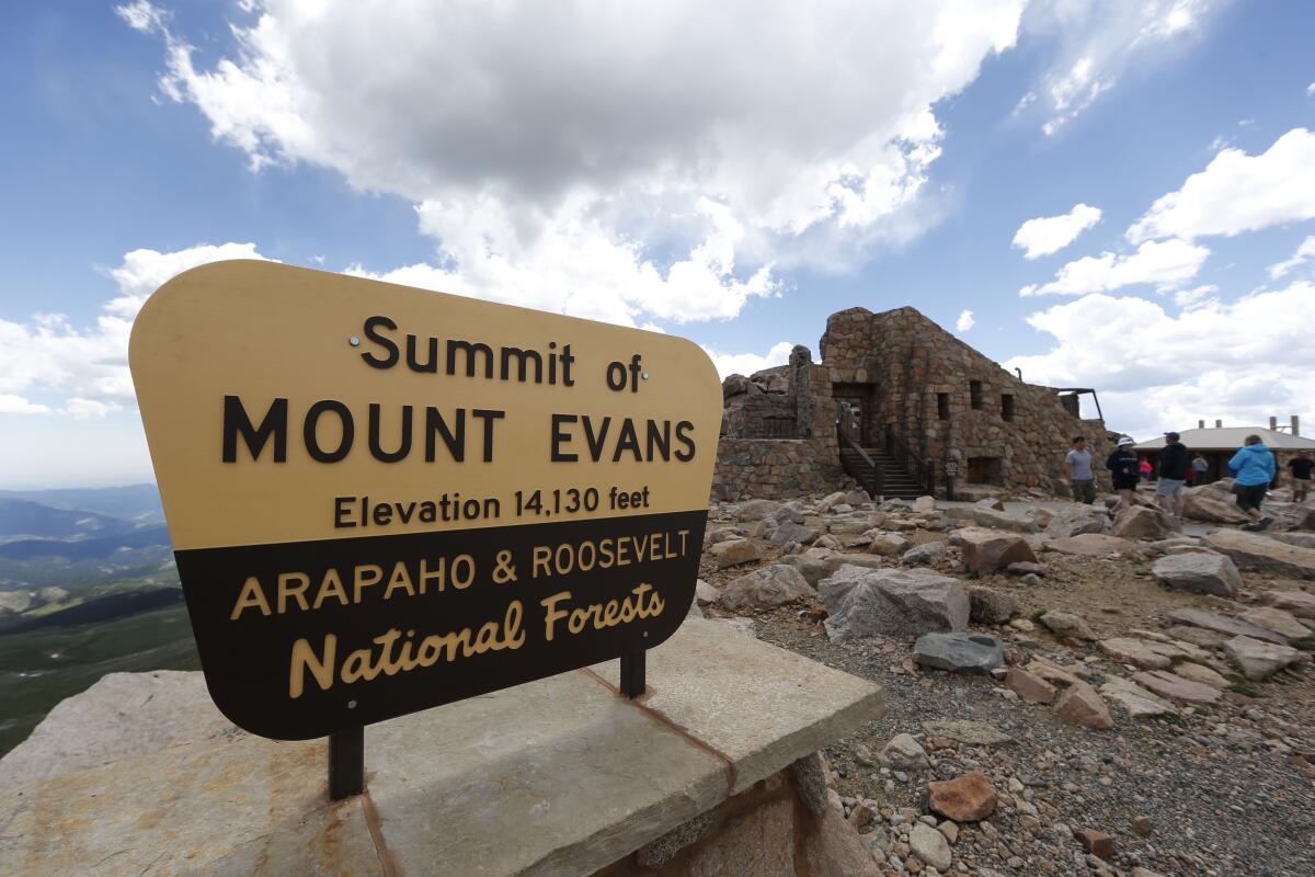 Sign at summit of Mt. Evans near Idaho Springs, Colo.