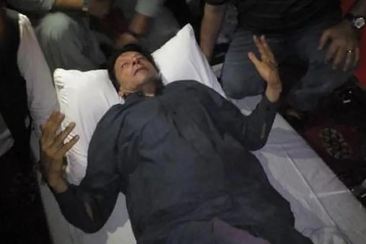 Former Pakistani Prime Minister Imran Khan lying down after being shot