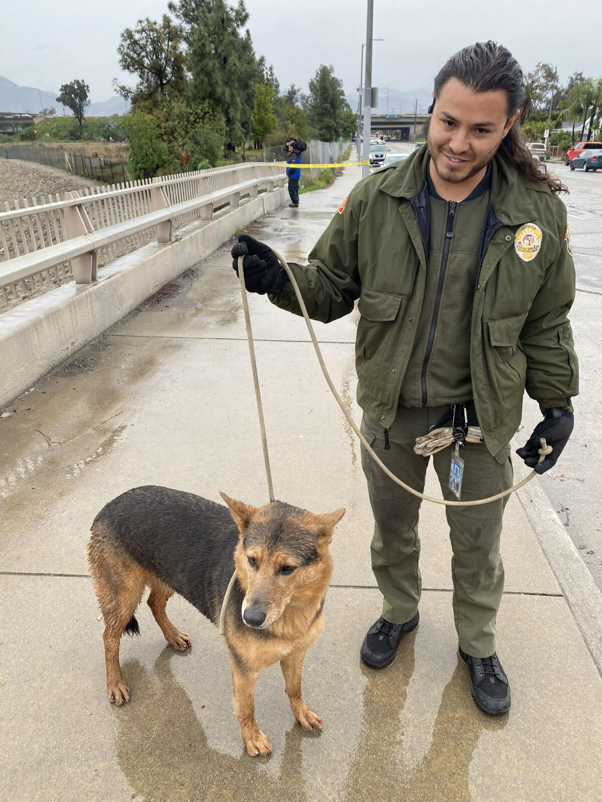 Man Rescuing Dogs Amid L.A. storm, man jumps into water to save dog. Then he needs ...