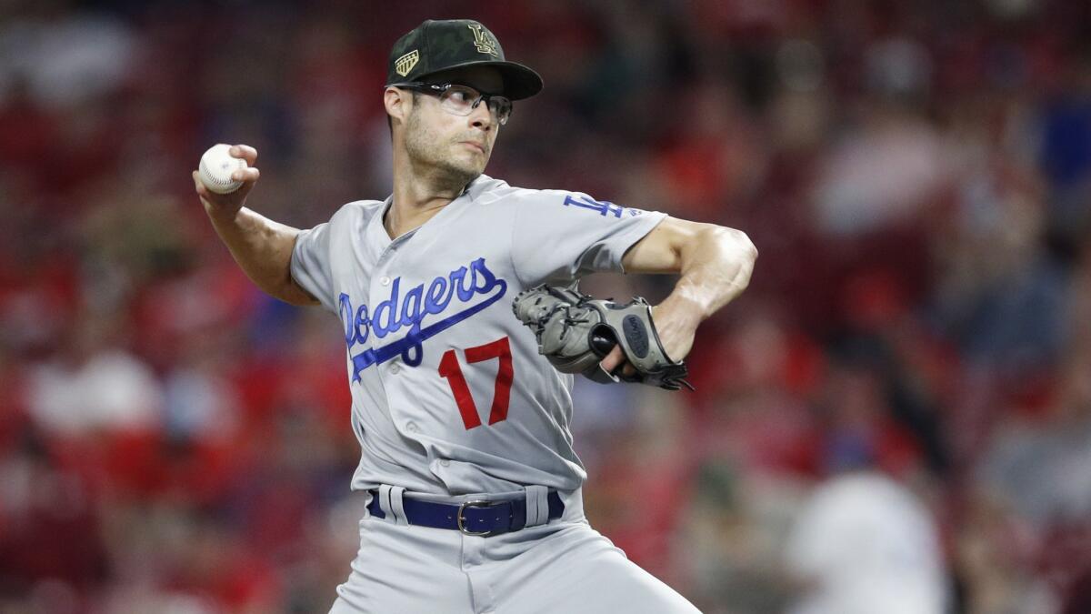 Joe Kelly delivers during a game against the Cincinnati Reds on May 17. Kelly's contract makes it hard for the Dodgers to give up on the beleaguered reliever.