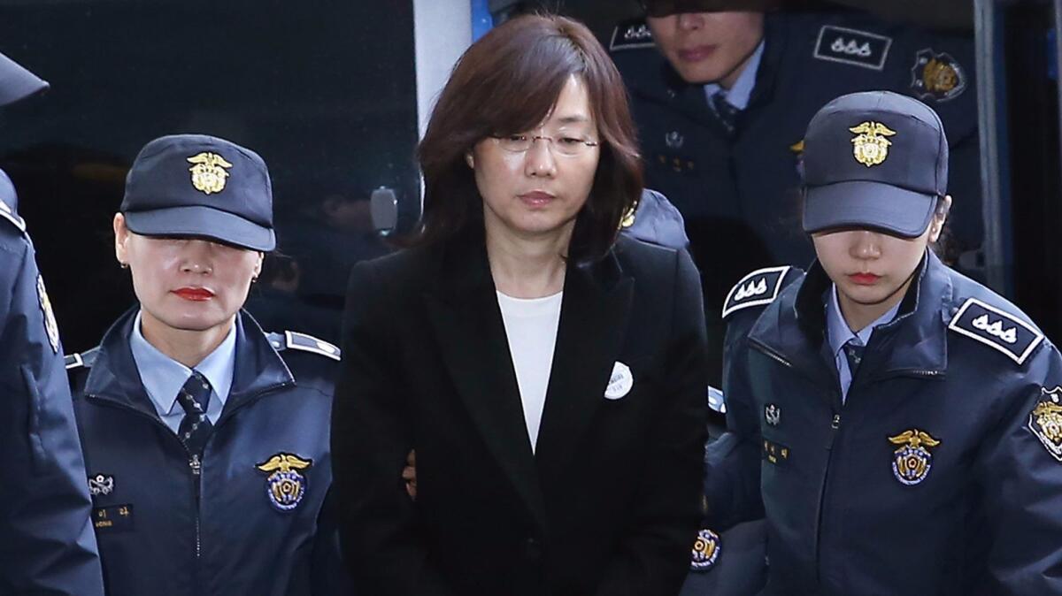 Former South Korean Culture Minister Cho Yoon-sun appears before the office of the independent counsel in Seoul.