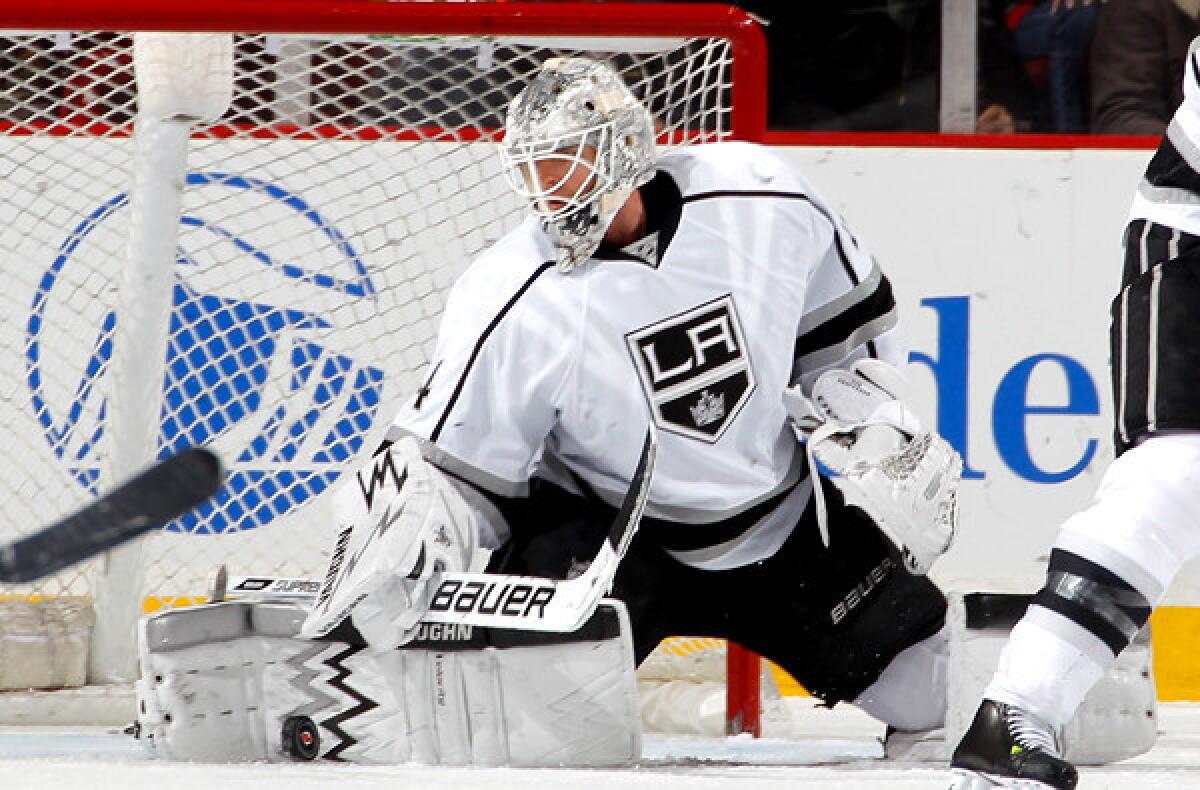 Kings goalie Ben Scrivens makes a save on a shot by the Devils in the first period Friday night.