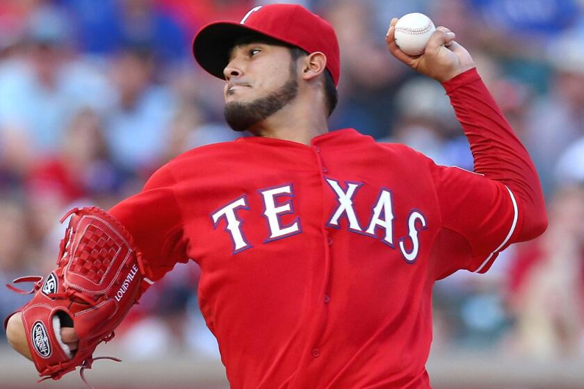 Rangers starting pitcher Martin Perez works against the Boston Red Sox during a game Saturday.