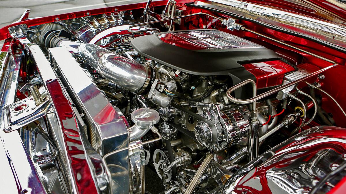 A look under the hood of Vernon Maxwell's 1961 Chevy Impala lowrider reveals a supercharged engine. (Irfan Khan / Los Angeles Times)