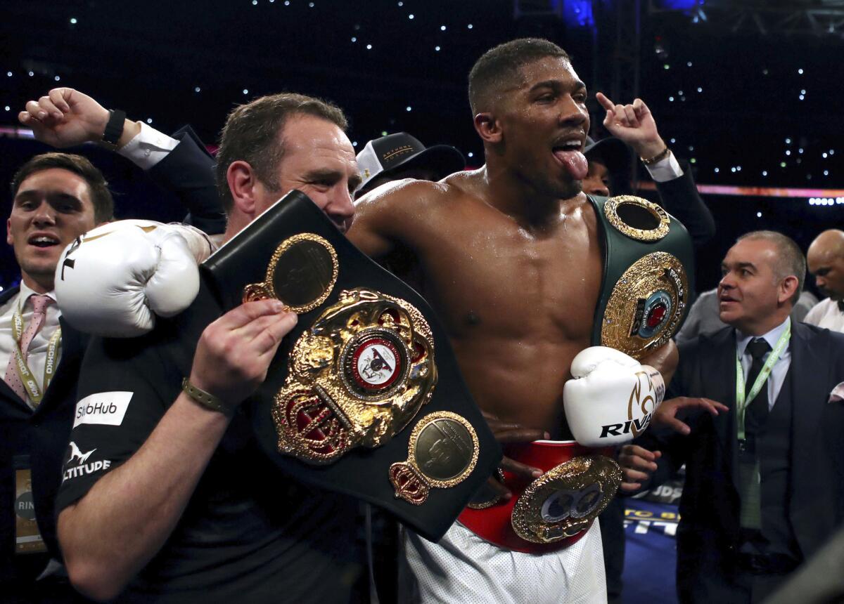 Anthony Joshua of Britain celebrates after defeating Wladimir Klitschko of Ukraine by technical knockout to retain the heavyweight title.