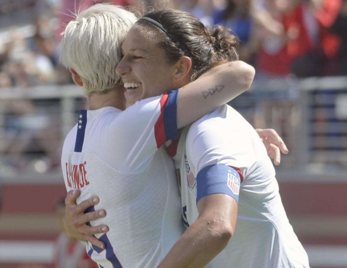 Carli Lloyd (10) gets a hug from forward Megan Rapinoe (15) after scoring a goal for the U.S.