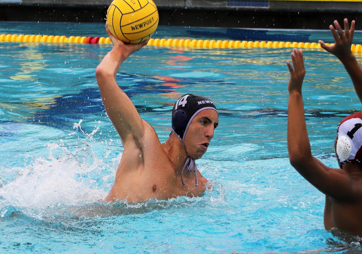 Newport Harbor's Connor Ohi (14) shoots for a goal at Corona del Mar High on Saturday.