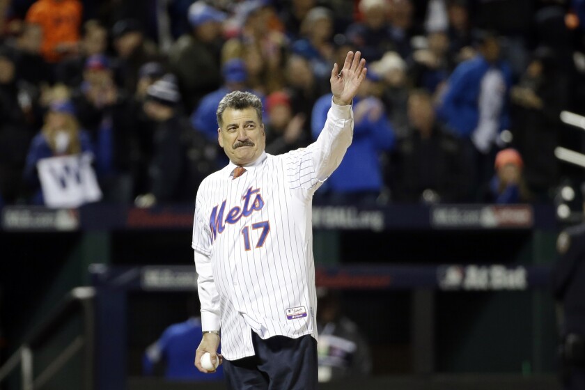 FILE - Keith Hernandez waves before throwing out the ceremonial first pitch before Game 1 of the National League baseball championship series between the New York Mets and the Chicago Cubs on Oct. 17, 2015, in New York. Hernandez will have his No. 17 retired by the Mets this summer to honor his seven seasons as a player and nearly three decades as a beloved broadcaster with the franchise. (AP Photo/David J. Phillip, File)