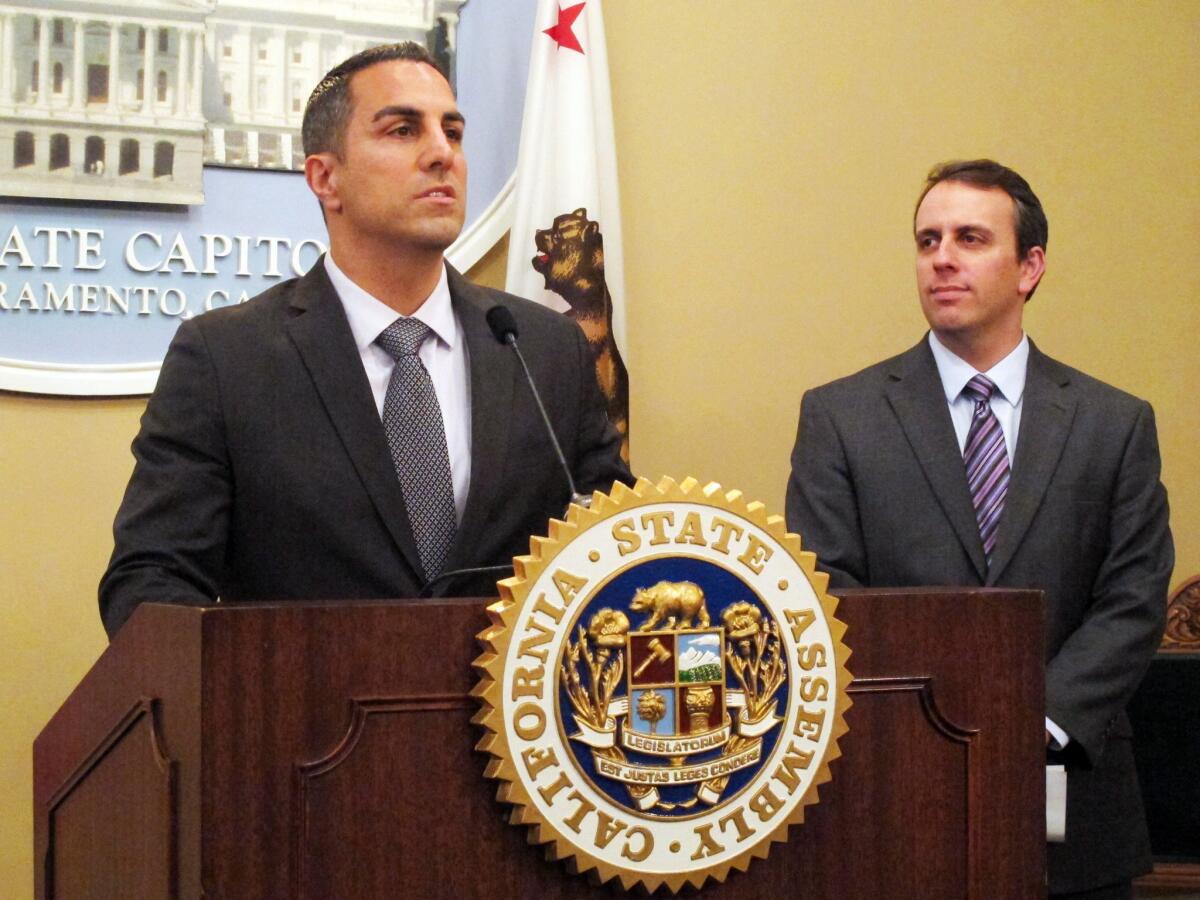 Assemblymembers Mike Gatto, D-Glendale (at podium), and Marc Levine, D-San Rafael, announce a proposal to overhaul the state's Public Utilities Commission in Sacramento on Feb. 3.