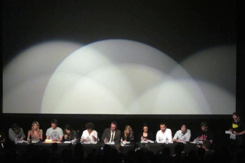 The cast and writers of the "The Middleman" reunite for a reading of "The Pan-Universal Parental Reconciliation," eventually to become a graphic novel. "Middleman" creator Javier Grillo-Marxuach is standing at right.