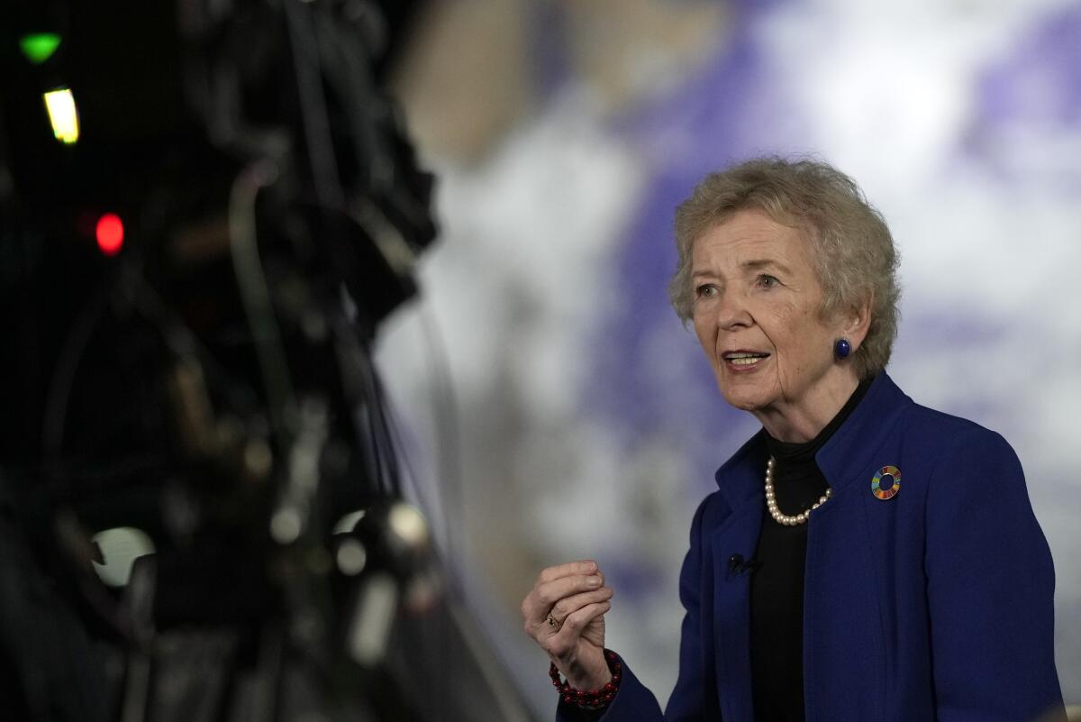 FILE - Mary Robinson, former President of Ireland, speaks during an interview at the COP26 U.N. Climate Summit in Glasgow, Scotland, Nov. 11, 2021. Robinson has called on African nations to pile on the pressure on rich, heavily-polluting countries to fulfill their climate pledges to the continent during a visit to Uganda. (AP Photo/Alastair Grant, File)