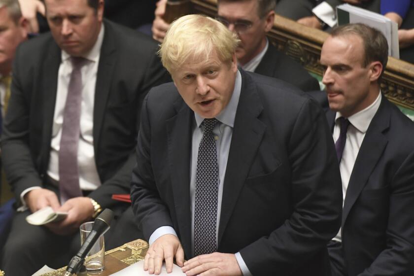 Britain's Prime Minister Boris Johnson speaks during the Brexit debate inside the House of Commons in London Saturday Oct. 19, 2019. At the rare weekend sitting of Parliament, Prime Minister Boris Johnson implored legislators to ratify the Brexit deal he struck this week with the other 27 EU leaders. Lawmakers voted Saturday in favour of the 'Letwin Amendment', which seeks to avoid a no-deal Brexit on October 31. (Jessica Taylor/House of Commons via AP)