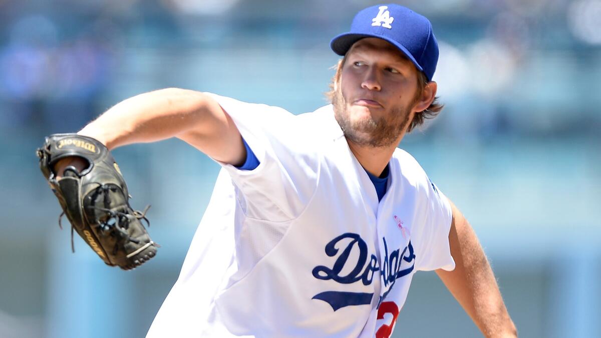 Dodgers starter Clayton Kershaw delivers a pitch during the second inning of the team's 7-4 loss in 10 innings to the San Francisco Giants on Sunday.