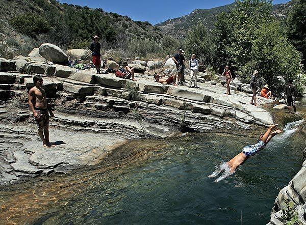 Children at a summer camp play in one of the many waterholes along Matilija Creek. See full story