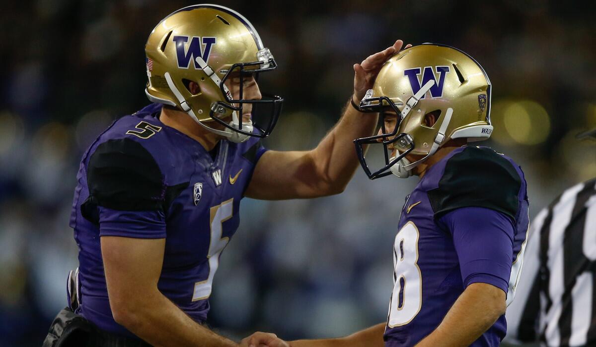 Washington kicker Cameron Van Winkle, right, is congratulated by holder Jeff Lindquist after kicking a field goal against Arizona State on Saturday.
