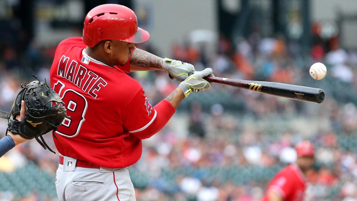 Angels third baseman Jefry Marte connects for a sacrifice fly against the Tigers in the sixth inning Sunday.