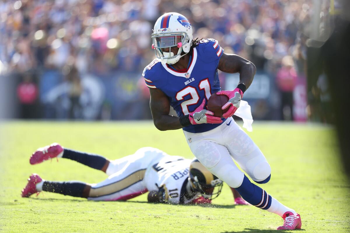 Bills cornerback Nickell Robey-Coleman heads to the end zone for a pick-six interception as Rams receiver Pharoh Cooper falls to the turf.