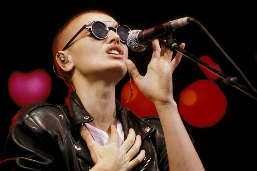 Sinead O’Connor performs on stage at the Glastonbury Festival in England in 1990.