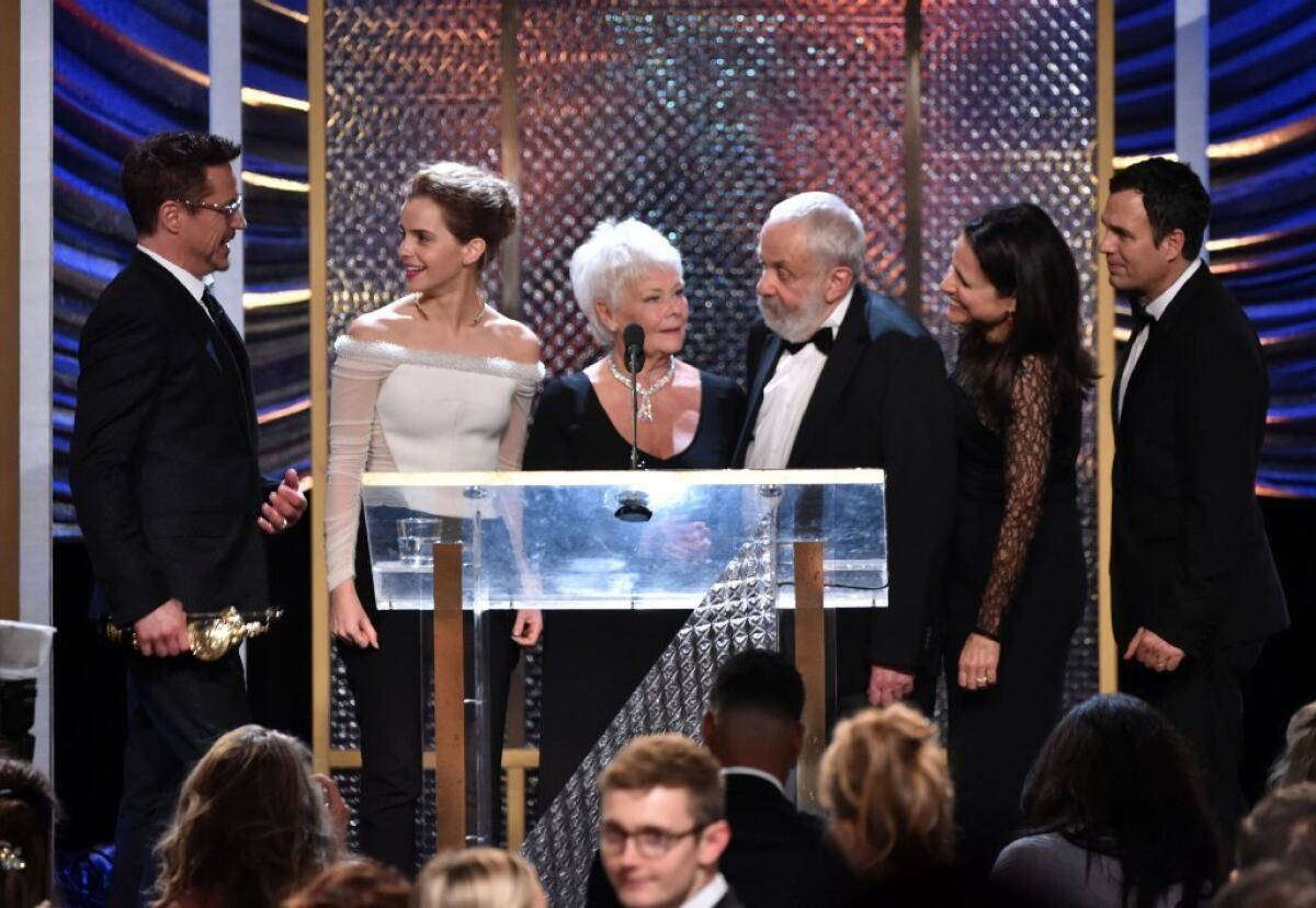 The winners of the BAFTA Los Angeles' Britannia Awards gather on stage at the Beverly Hilton Hotel on Thursday evening. From left are Robert Downy Jr., Emma Watson, Judi Dench, Mike Leigh, Julia Louis-Dreyfus and Mark Ruffalo.