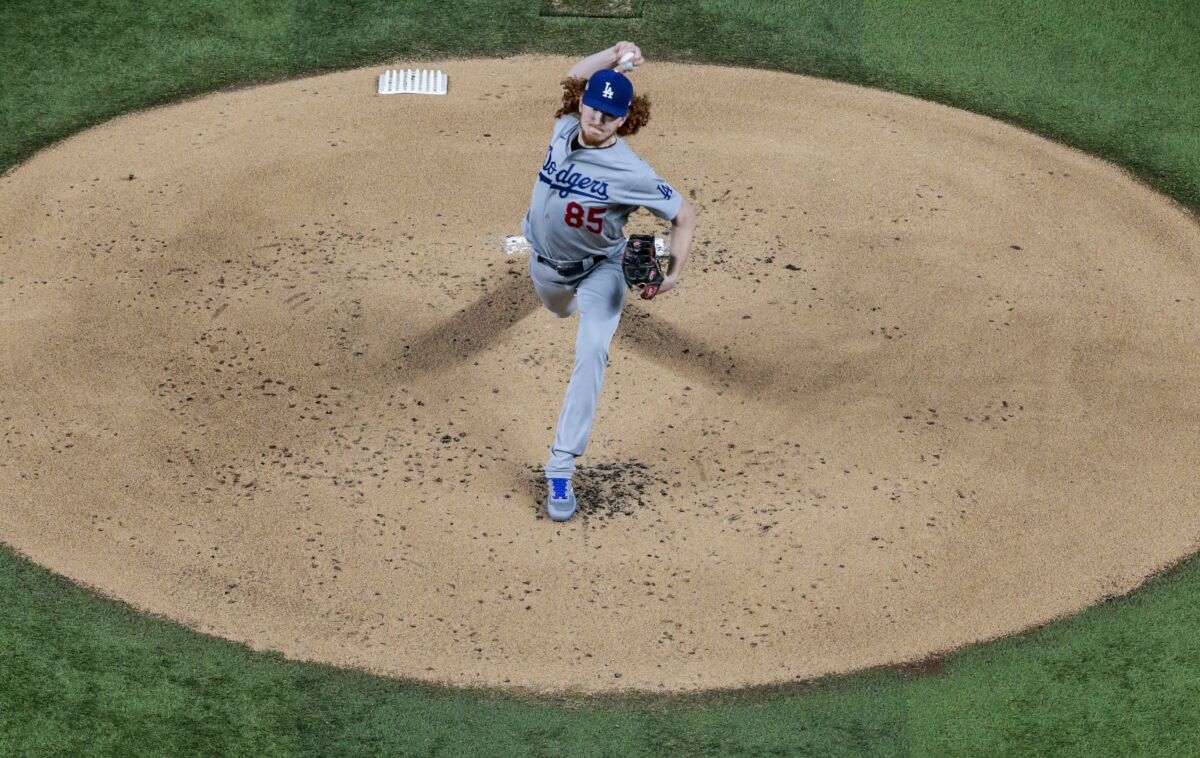 Dodgers starting pitcher Dustin May delivers during the first inning of Game 5 of the NLCS.