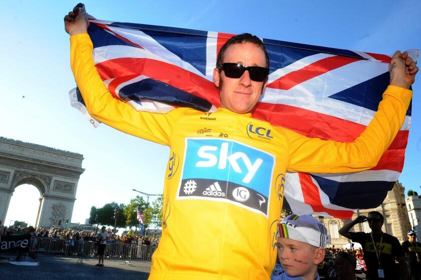 Bradley Wiggins, shown celebrating his 2012 Tour de France victory, has withdrawn from this year's event because of a knee injury.