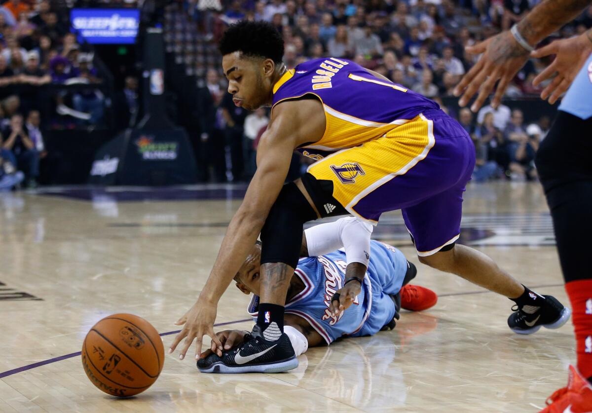 Sacramento Kings' Ben McLemore and Lakers' D'Angelo Russell go for the loose ball at Sleep Train Arena on Friday.