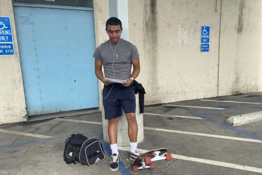 Daniel Najar of Reseda rode his skateboard to school for the start of football practice on Monday.