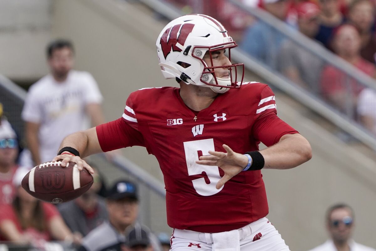 Wisconsin's Graham Mertz throws during the first half of an NCAA college football game against Michigan Saturday, Oct. 2, 2021, in Madison, Wis. (AP Photo/Morry Gash)