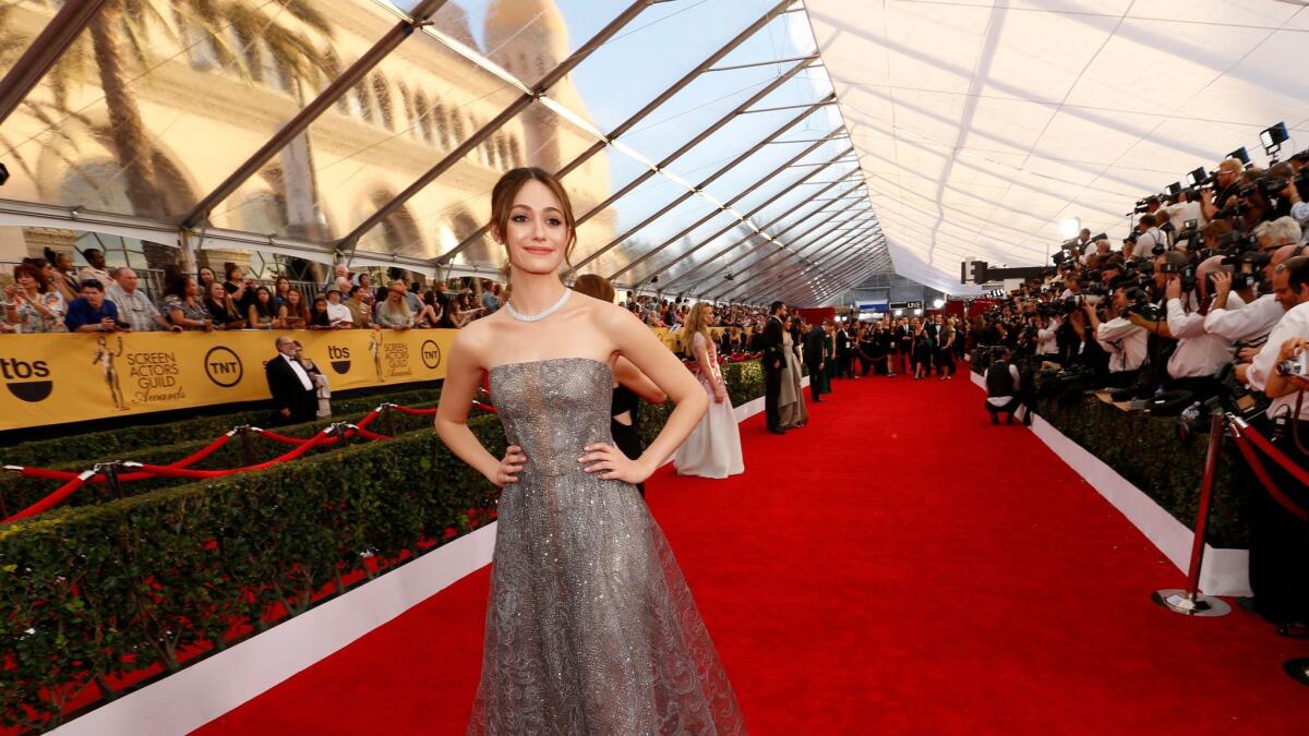 Emmy Rossum poses on the red carpet at the Screen Actors Guild Awards in 2015.