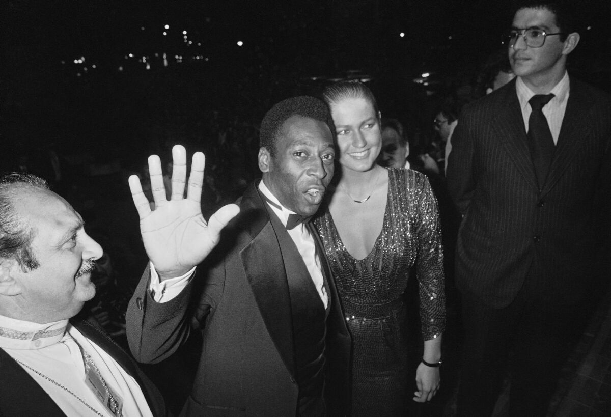 FILE - Brazilian soccer star Pele and his girlfriend Xuxa arrive to see the