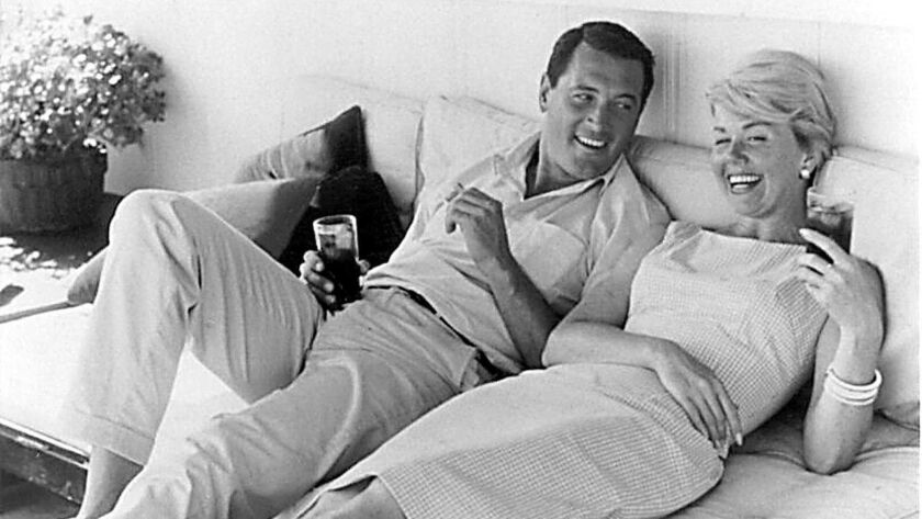 Doris Day relaxes with Rock Hudson off-screen. The two co-starred in a number of box-office hits, most famously 1959's "Pillow Talk."
