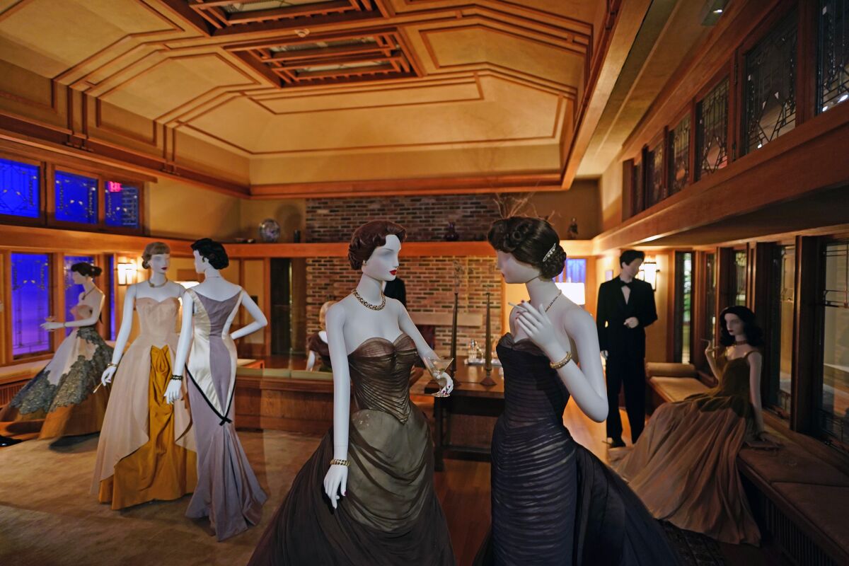 A scene staged by film director Martin Scorsese featuring fashions by designer Charles James and a room by architect Frank Lloyd Wright is displayed as part of the Met Museum Costume Institute's exhibit "In America: A Lexicon of Fashion," Saturday, April 30, 2022, in New York. (Photo by Charles Sykes/Invision/AP)