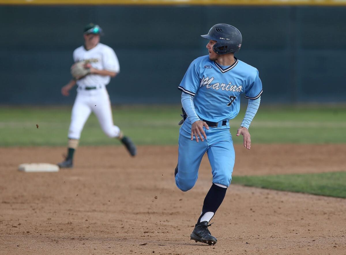 Marina High's Steven Casas, pictured running against Edison on March 5, helped the Vikings beat Capistrano Valley Christian 5-4 on Monday.