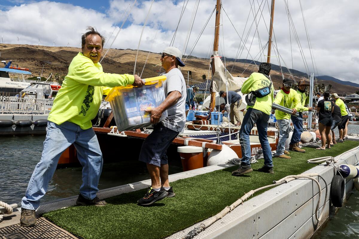 Supplies for Lahaina fire victims are gathered and delivered by Hawaiians sailing on a large catamaran.