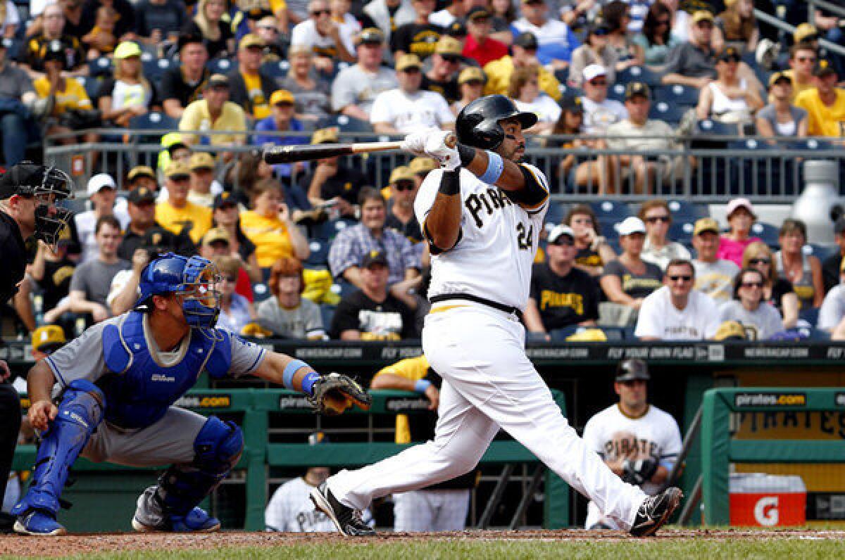 Pittsburgh Pirates' Pedro Alvarez hits a three-run home run in the fifth inning against the Dodgers.