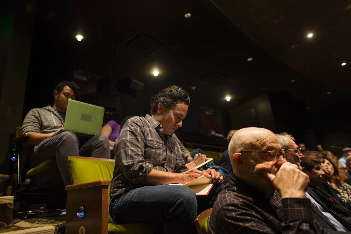 LOS ANGELES, CA - APRIL 25, 2017 : Playwright Rajiv Joseph takes notes during intermission on opening night of a preview performance for his new play "Archduke" on April 25, 2017 at the Mark Taper Theatre in Los Angeles, California.(Gina Ferazzi / Los Angeles Times) (Gina Ferazzi / Los Angeles Times)