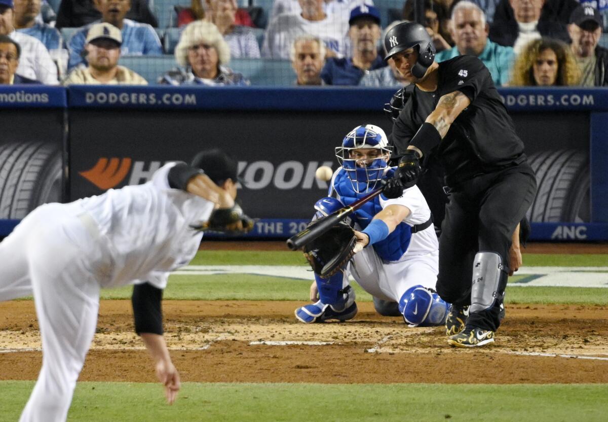 Yankees catcher Gary Sanchez hits a solo home run off Dodgers starter Hyun-Jin Ryu on Friday.