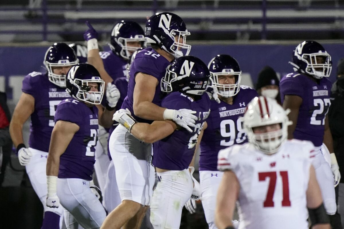 Northwestern players celebrate after they defeated Wisconsin 17-7 on Nov. 21, 2020.