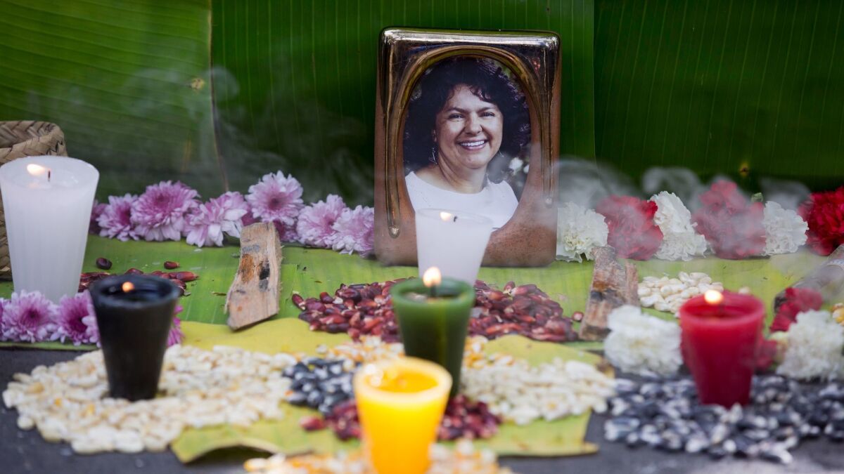 A makeshift altar honors environmentalist Berta Caceres during a demonstration outside Honduras' embassy in Mexico City in June 2016.