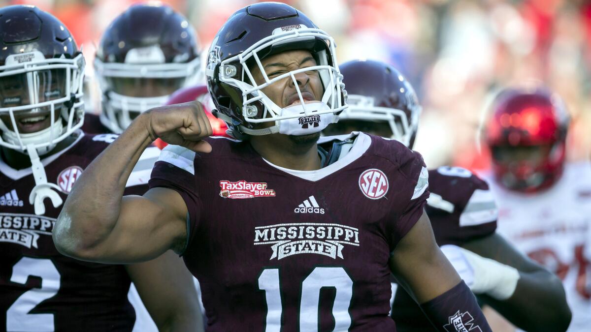 Mississippi State quarterback Keytaon Thompson celebrates after scoring a touchdown against Louisville during the second half Saturday.