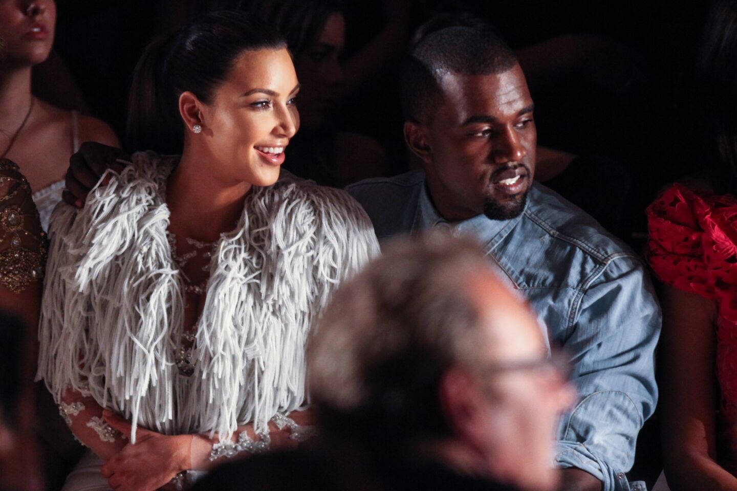Kim Kardashian and rapper Kanye West attend the Marchesa spring 2013 fashion show during New York Fashion Week on Sept. 12, 2012.
