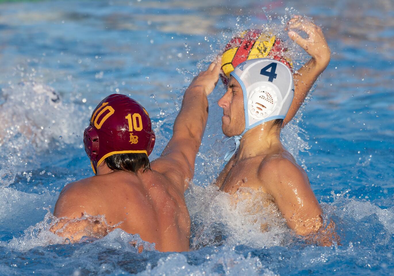 Wilson's Kade Margain blocks a shot by Corona del Mar's Tyler Harvey during a first round CIF Southern Section Division 2 playoff game on Wednesday, October 31.
