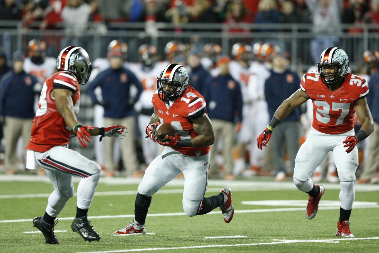 Ohio State's Curtis Grant runs with the ball after an interception in the first half.