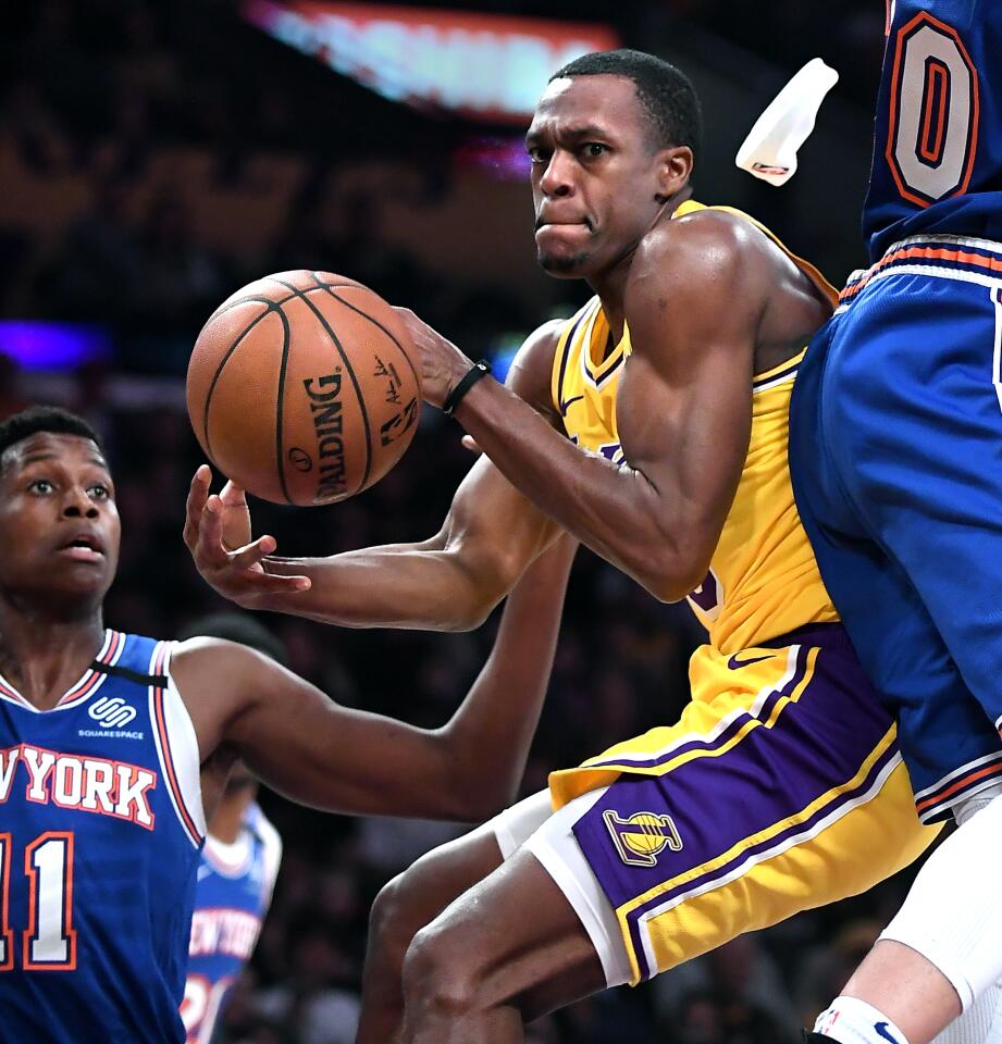 Rajon Rondo loses his head band as he gets a pass off against the Knicks during the second quarter of a game Jan. 7 at Staples Center.