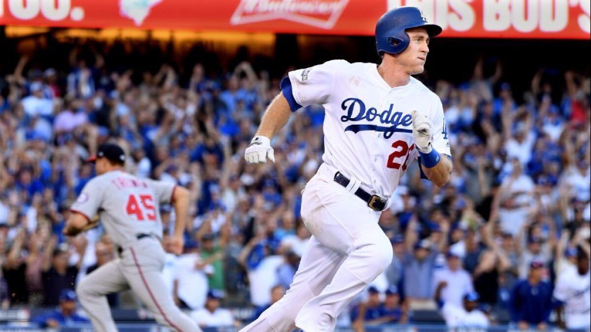 Dodgers second baseman Chase Utley drives in the go-ahead run in the eighth inning of Game 4 of the National League division playoff series against the Washington Nationals on Oct. 11, 2016.
