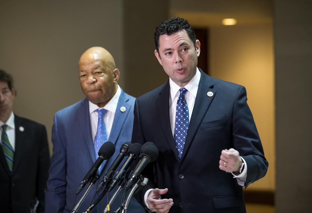 Rep. Jason Chaffetz (R-Utah), right, and Elijah Cummings (D-Md.) on April 25 discuss former national security advisor Michael Flynn's possible failure to disclose payments from foreign countries.