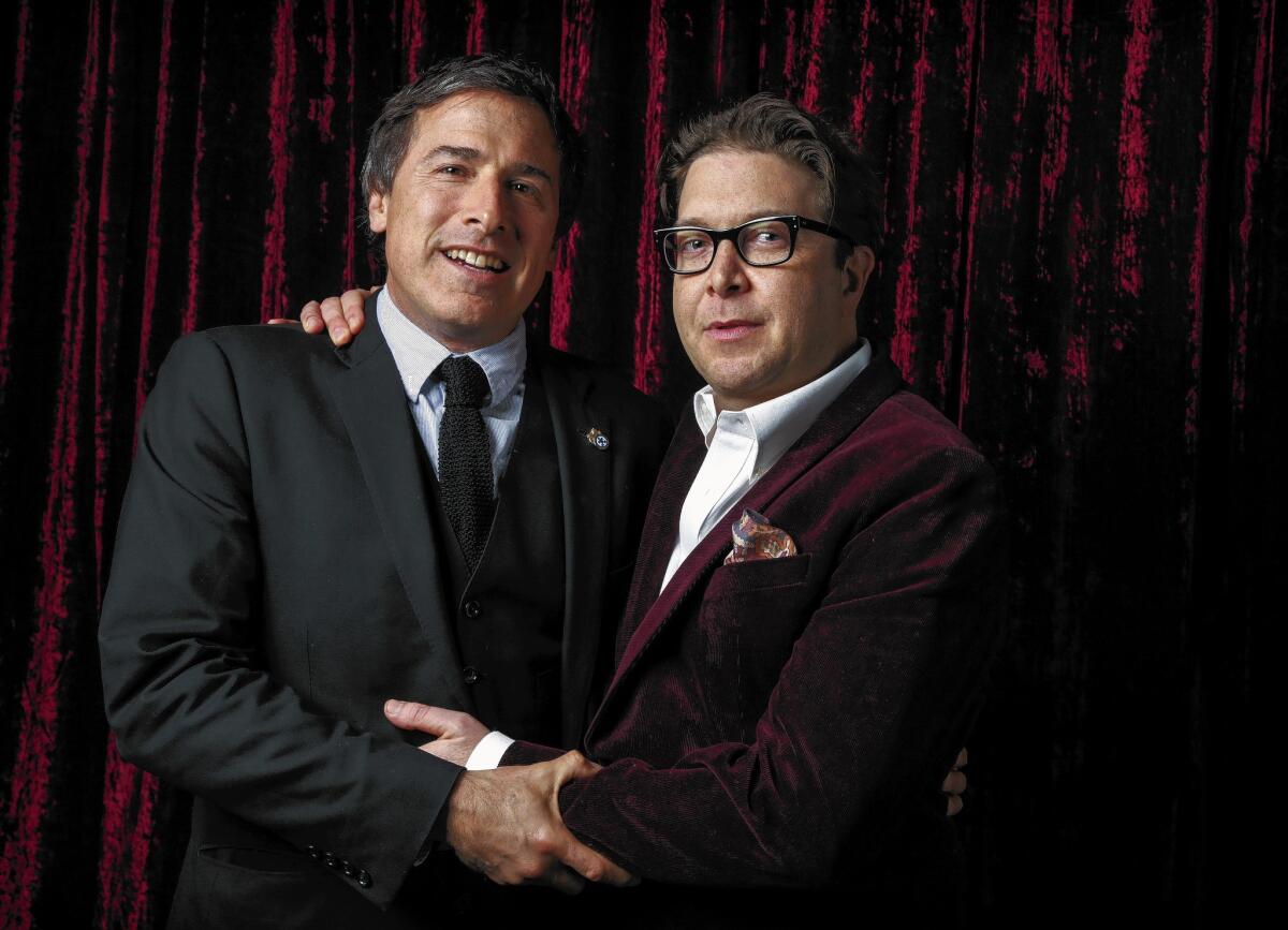 Writer-director David O. Russell, left, with "American Hustle" scriptwriter Eric Warren Singer.