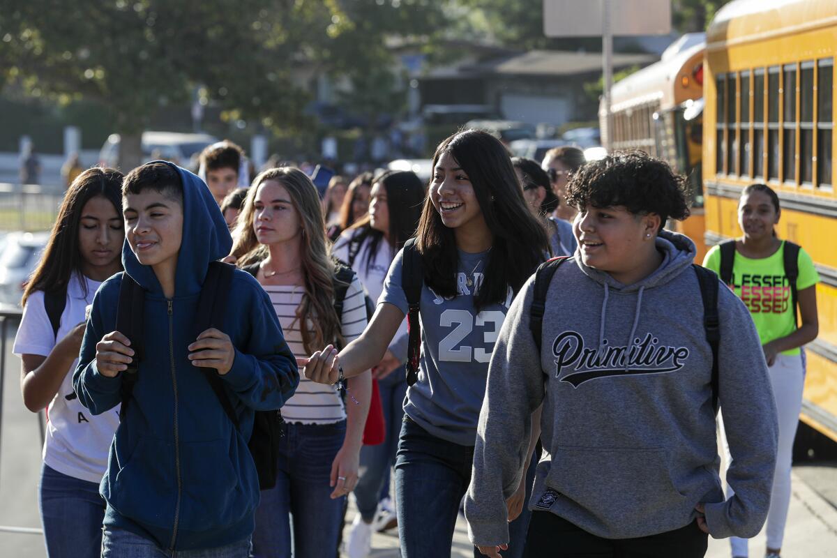 LAUSD students walk onto campus at Rudecinda Sepulveda Dodson Middle School.