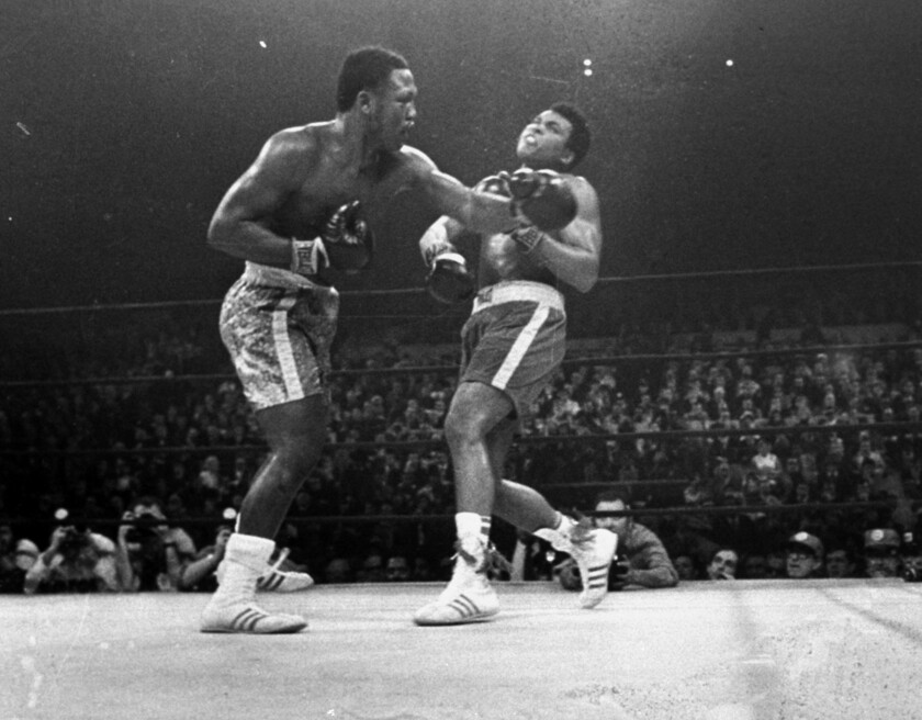 FILE - Joe Frazier hits Muhammad Ali with a left during the 15th round of their heavyweight title fight at New York's Madison Square Garden, in this March 8, 1971, file photo. Frazier was a relentless puncher filled with rage toward a fighter who couldn’t help but belittle him.(AP Photo/File)